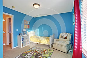 Cute kids room with blue walls.