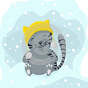 Cute kitten in winter hat playing in the snow