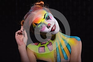 Cute lady with a face painting clown