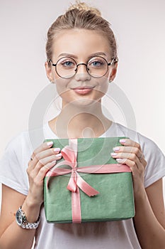 Cute lady is going to presen a gift to favourite sister