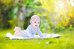 Cute laughing baby in the garden