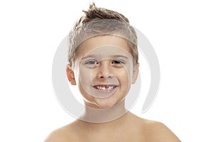 Cute laughing boy without a front tooth. Isolated on a white background.