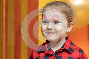 Cute laughing little girl with beautiful painted face