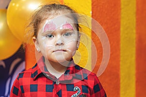 Cute laughing little girl with beautiful painted face