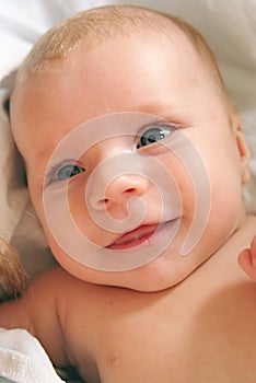 Cute laughing newbornbaby with blue eyes