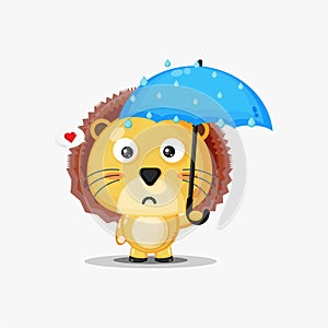 Cute lion carrying an umbrella in the rain