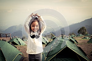 Cute litte asian girl having fun in the camp