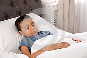 Cute little African-American boy sleeping