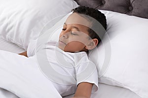 Cute little African-American boy sleeping