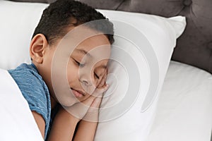 Cute little African-American boy sleeping