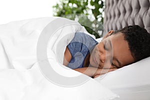 Cute little African-American boy sleeping