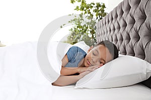 Cute little African-American boy sleeping