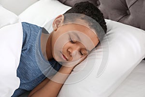 Cute little African-American boy sleeping