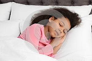 Cute little African-American girl sleeping