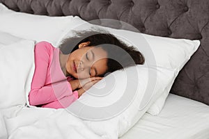 Cute little African-American girl sleeping