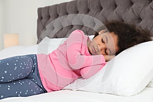 Cute little African-American girl sleeping