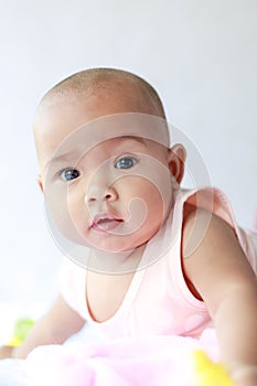 Cute little Asian baby sitting and play with happiness