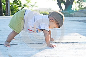 Cute little asian baby stoop on floor