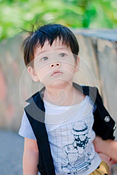 Cute little  Asian boy Happy smilling  in the park outdoors , Happy kids