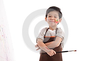 Cute little asian boy painting isolated