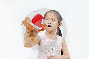 Cute Little Asian child girl hand wearing and playing Lion puppets on white background, Lion head
