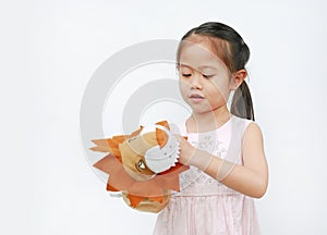 Cute Little Asian child girl hand wearing and playing Lion puppets on white background, Lion head