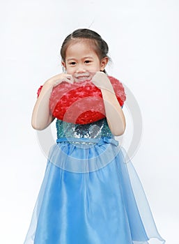 Cute little Asian child girl holding red heart pillow on white background. Happy valentines day