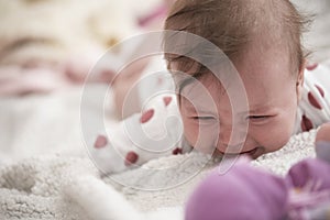 cute little baby in bed crying