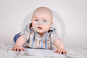 Cute little baby boy crawling on the floor