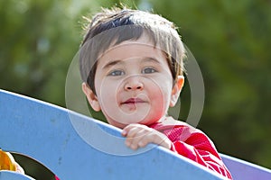 Cute little baby boy playing at park