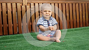 Cute little baby boy, playing with toys outdoors, sunny kids.