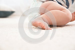 Cute little baby on carpet indoors. Crawling time