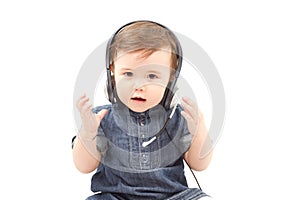 Cute little baby child in headphones