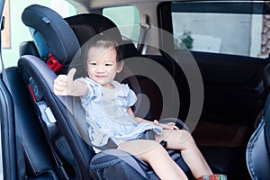 Cute little baby child sitting in car seat. Child transportation safety
