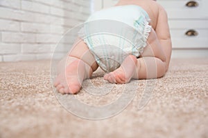 Cute little baby crawling on carpet indoors