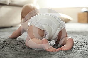 Cute little baby in diaper, focus on legs