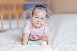 Cute little baby girl, playing with colorful easter eggs