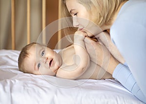 Cute little baby and loving mother, closeup