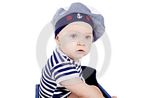 Cute little baby in sailor fashion playing