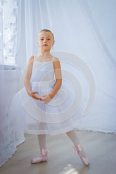 Cute little ballerina posing
