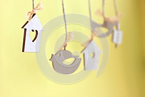 cute little bird houses and wooden birds hanging, spring coming concept