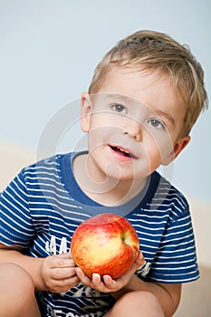 Cute little boy with apple