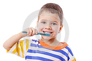 Cute little boy brushing teeth