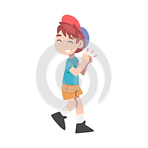 Cute Little Boy Clapping his Hands, Joyful Kid Wearing Shorts, T-shirt and Baseball Cap Expressing Enjoyment