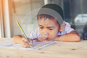 Cute little boy doing his homework