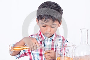 Cute little boy doing science experiment