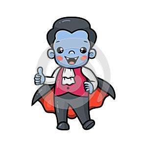 Cute little boy dracula cartoon stands and giving thumb up