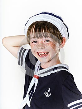 Cute little boy dressed in sailor suit