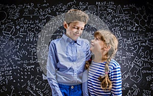 Cute little boy and girl in front of a big