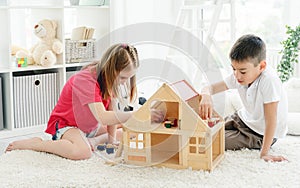 Cute little boy and girl playing indoors